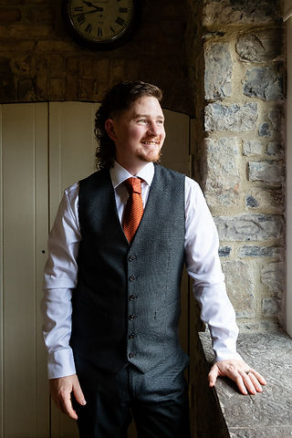 Relaxed portrait ready to meet his bride at the altar.