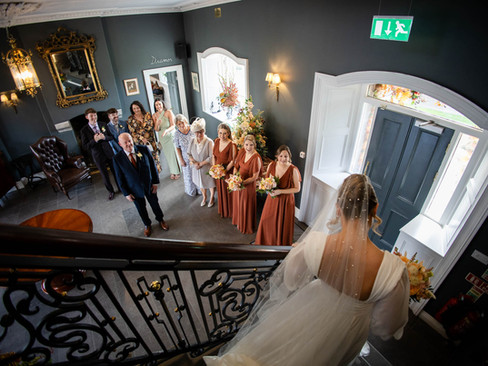 Candid reaction of a father seeing his daughter in her wedding dress.
