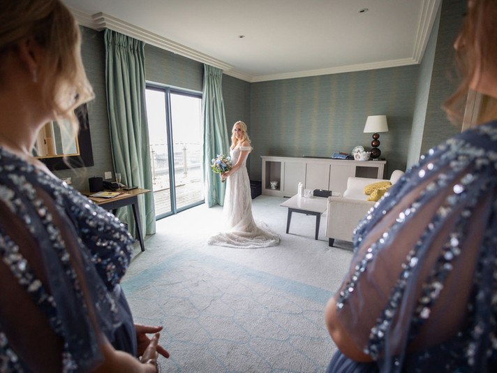 Sisterhood Spectacle: The Galmont hosts a heartfelt first look between the bride and her bridesmaids - a touching moment of camaraderie and shared joy