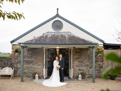 Bride and groom sharing a quiet moment in the gardens at Clonabreany House.