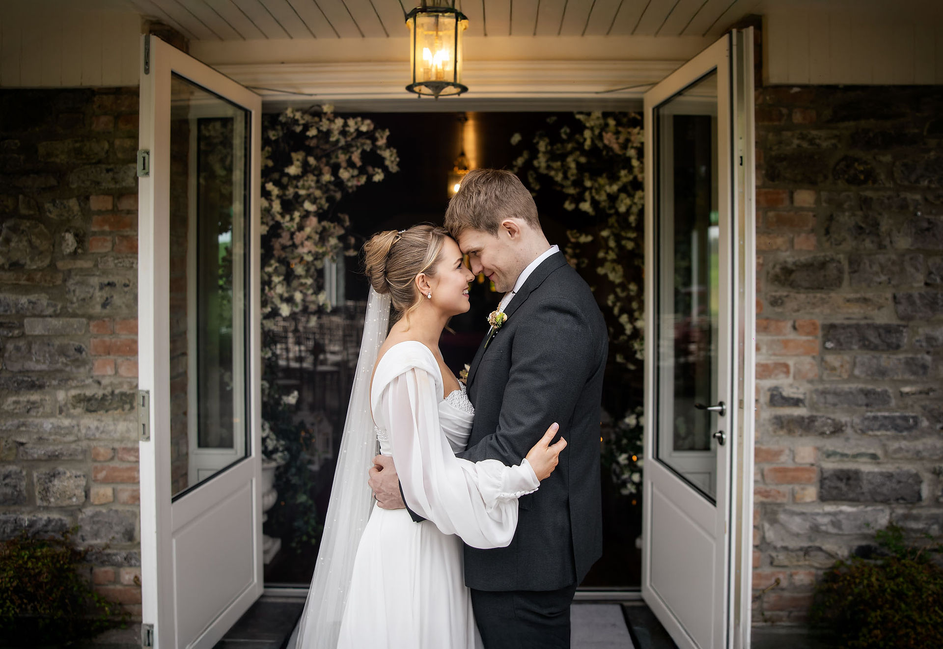 Elegant wedding portrait of a couple walking through the Clonabreany House estate.
