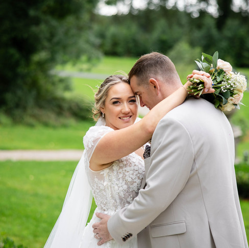 Megan and Rob enjoy the natural beauty of Cabra Castle’s gardens, perfect for relaxed outdoor portraits.