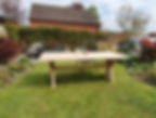 a 2.4 metre garden table in a garden
