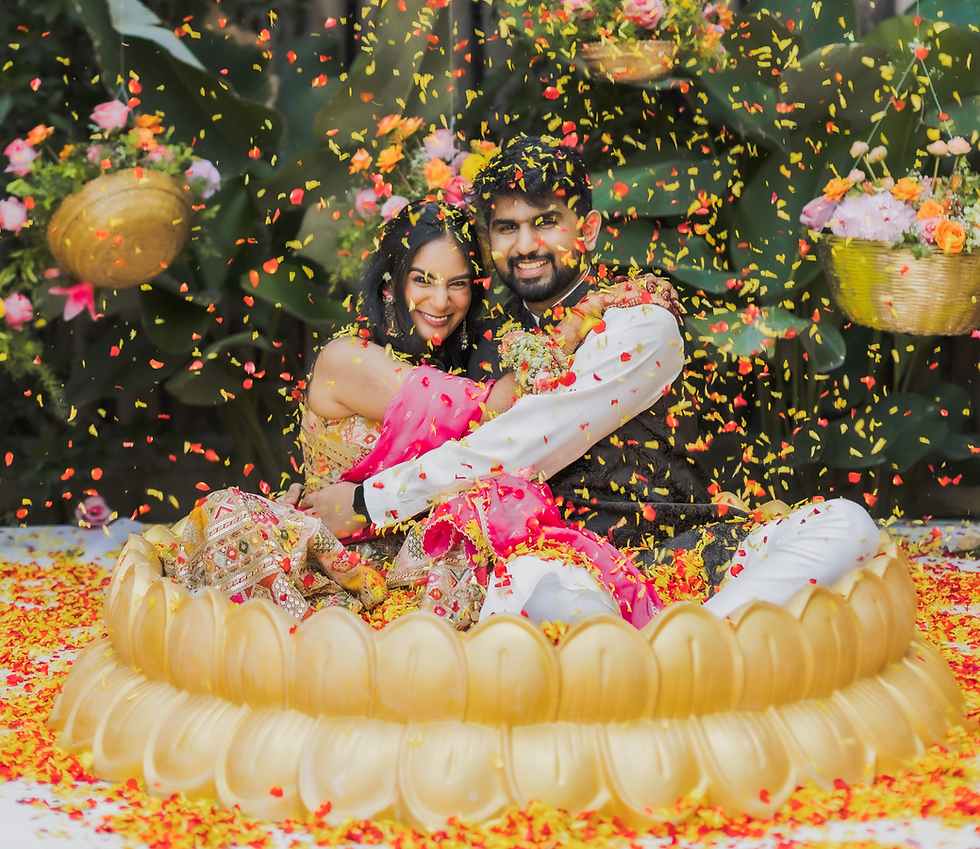 - Indian wedding ritual with golden lotus seat and falling petals