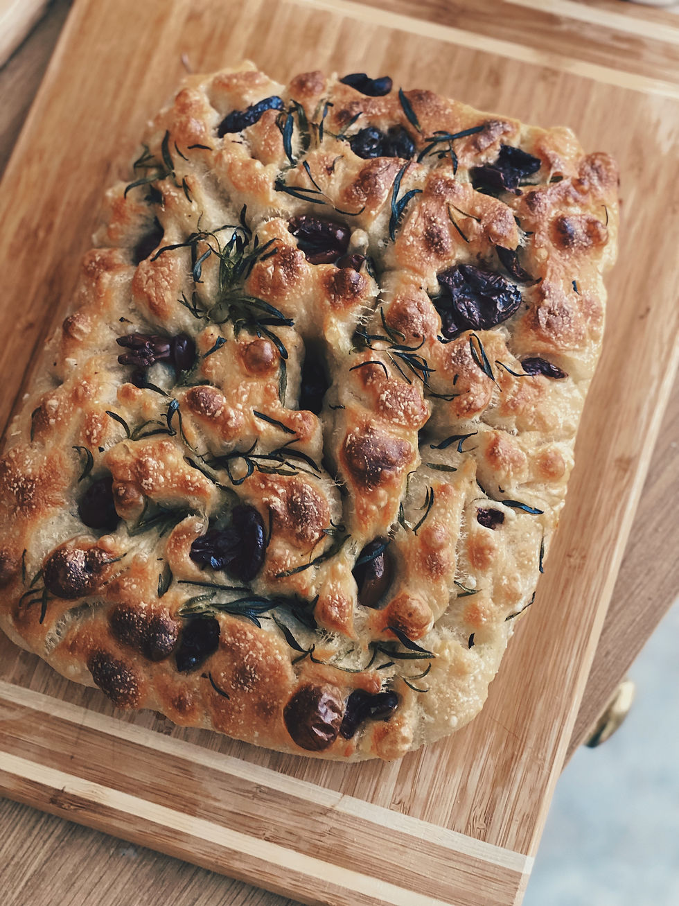 sourdough focaccia with olives and rosemary. lots to fermentation bubbles light and fluffy texture