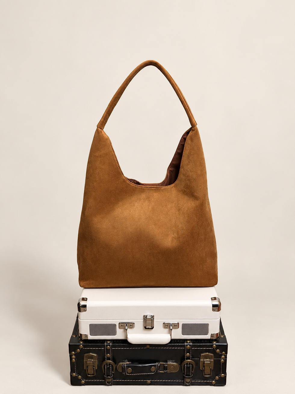 Crossi New York cognac suede hobo bag front view with curved shoulder strap