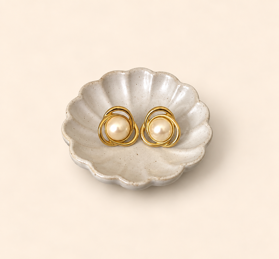 Vintage pearl swirl gold-tone earrings close-up detail