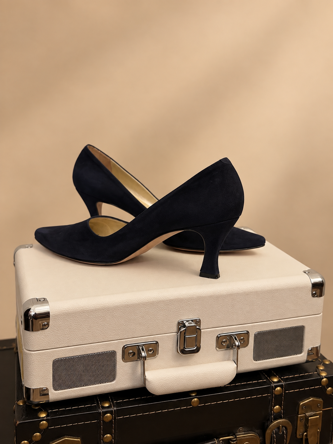 Anne Klein navy suede pumps side view