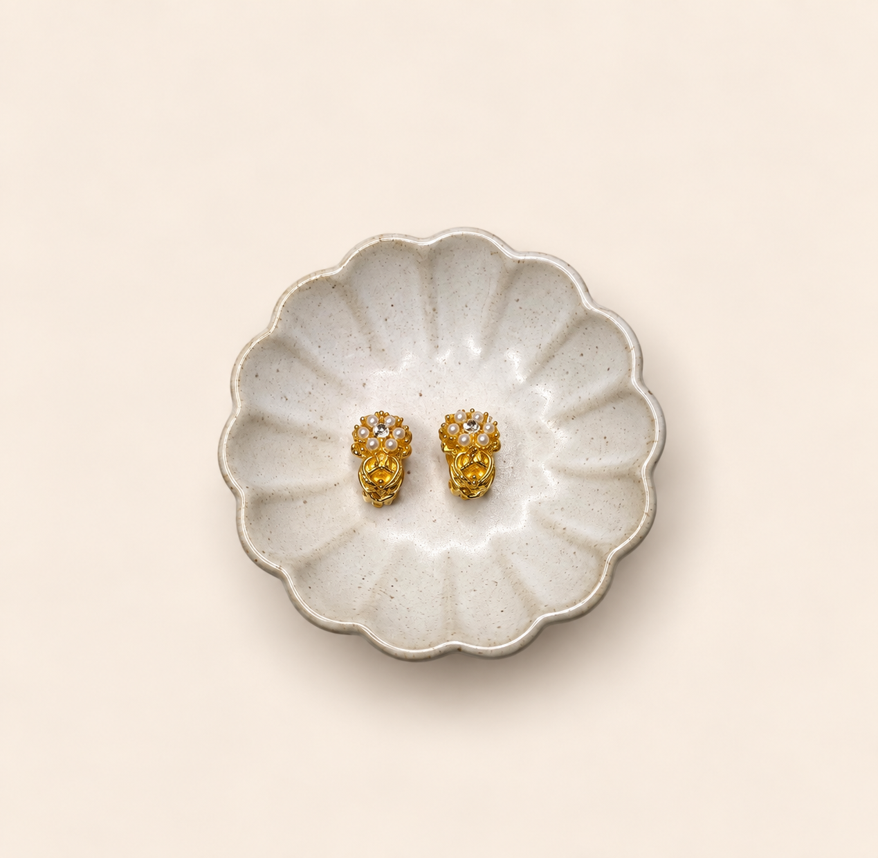 Gold-tone pearl cluster clip-on earrings styled display