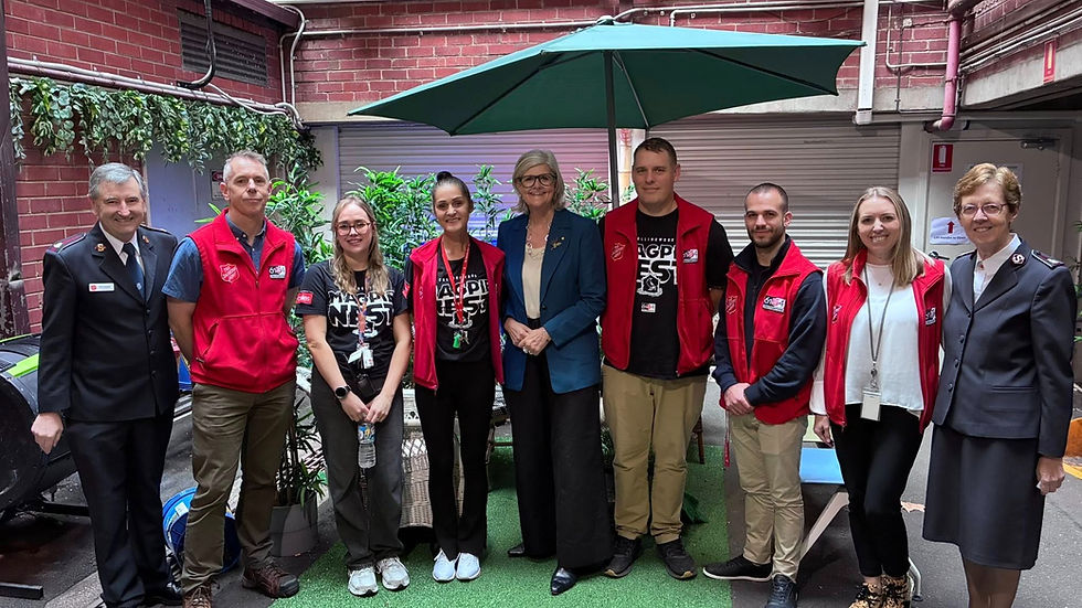 Governor-General Her Excellency the Honourable Sam Mostyn (centre) flanked by Project 614 and Magpie Nest personnel, with Lieutenant-Colonel Paul Hateley (far left) and Commissioner Miriam Gluyas (far right). Image: Supplied