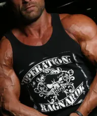 Muscular man in black tank top with "Operation Ragnarok" text, posing with arms crossed. Wearing white cap against dark background.