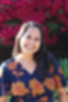 Marcella Lopez, a Latina woman of Mexican American background. She is smiling and approachable in the sunlight. She is a freelance copyeditor, proofreader, and authenticity reader. She also writes a blog and is working on writing a children's book.