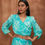 Thumbnail: Dazzle wrap around blouse combined with overlapping skirt.