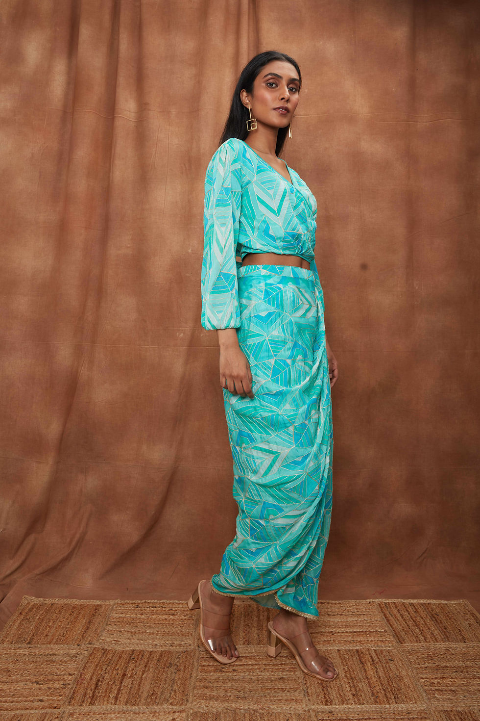 Thumbnail: Dazzle wrap around blouse combined with overlapping skirt.