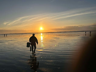 Man clamming at sunset