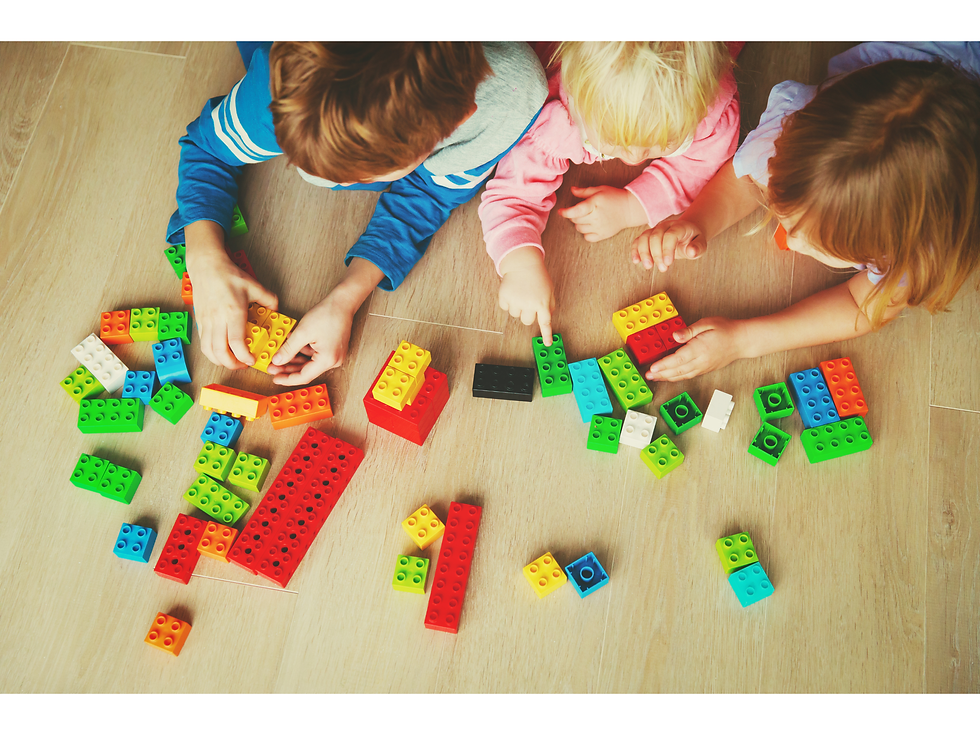 Eye-level view of a child arranging colorful blocks to learn fractions