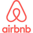 Logo Airbnb rouge et blanc sur fond blanc représentant une maison.