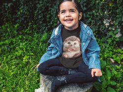little-girl-wearing-a-denim-jacket-and-t-shirt-mockup-in-the-garden-a12098