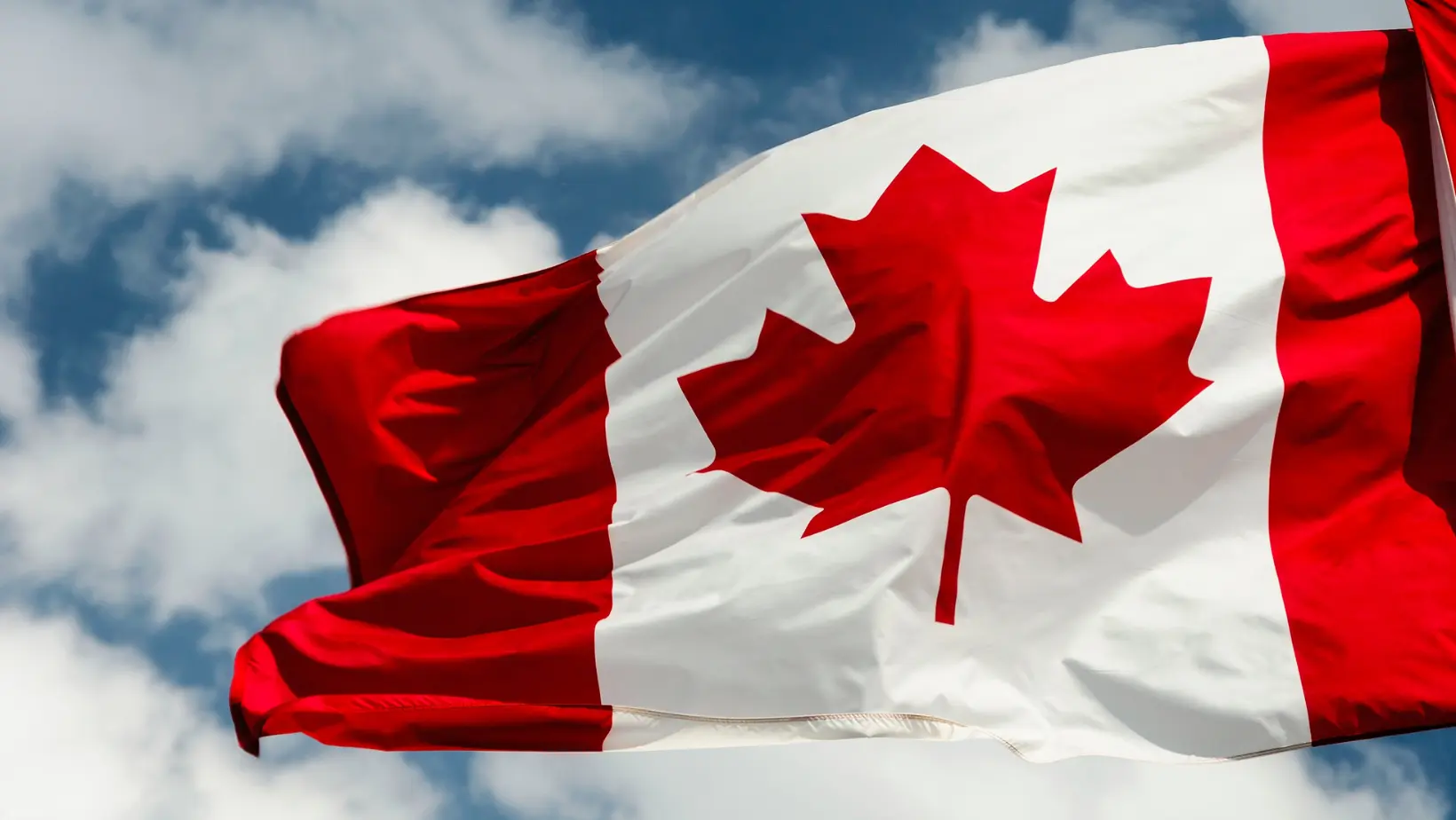 canadian flag blowing in the wind