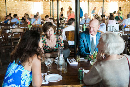 Wedding guest chit chat at a reception table