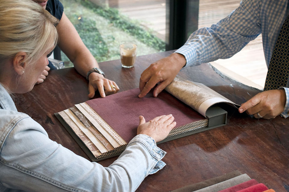 The Cranberry Design team looking a samples for texture and colour selection.