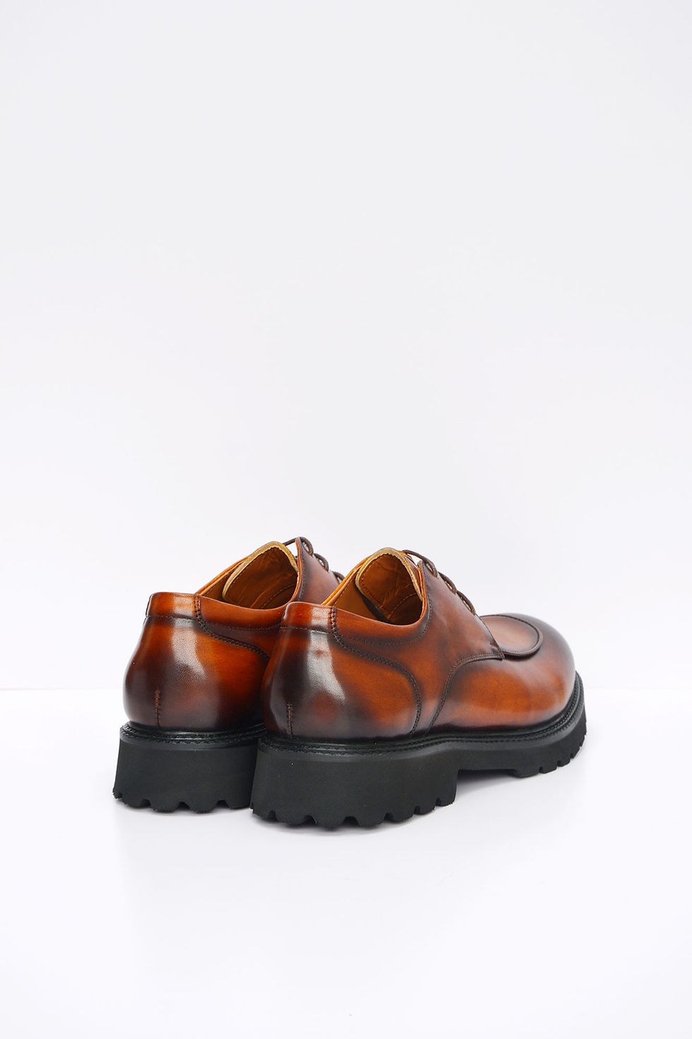 Thumbnail: Back view of men’s brown leather derby shoes