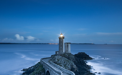 gray lighthouse on islet with concrete pathway at daytime_edited.jpg