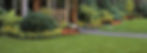 GrassHeads Outdoor Living fresh cut lawn and well maintained beds and plantings