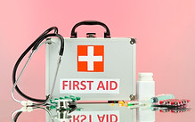 First Aid box on pink BG