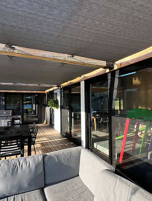 Clean patio windows and doors on a covered outdoor seating area at a Muskoka cottage