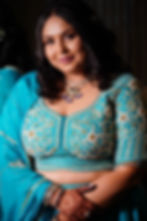 A TASTA bride for her engagement in a turquoise blue choli with 3D floral embroidery in zardozi & pearls.