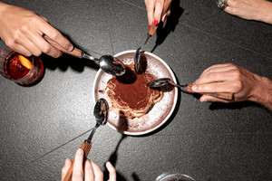 Guests sharing dessert during a memorable restaurant experience