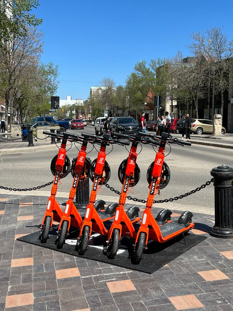 a row of e-scooters in downtown