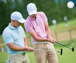 Golfers holding putters.png