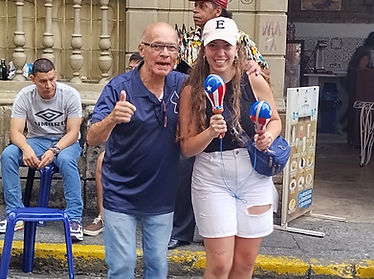 old man with young tourist holding maracas salsa street calle de la salsa