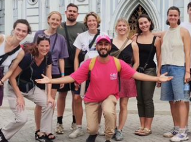 group of tourists with a guide in front of la ermita iglesia church in cali colombia