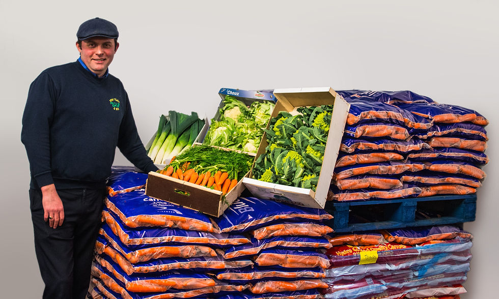 Tony stood in front of pallets of his vegetables
