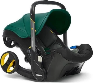Doona Autositz und Kinderwagen in einem grün.webp