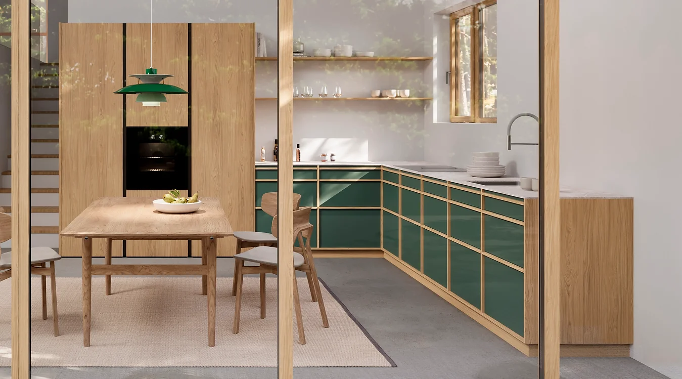 Japandi 2025 kitchen style in Jade Green, with light wooden elements, a Japanese-style pendant green light fixture, and Scandinavian, minimalistic style cabinets.