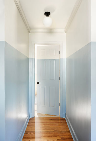 Hallway with unique paint color, two tone painted walls, baby blue hallway, modern hallway