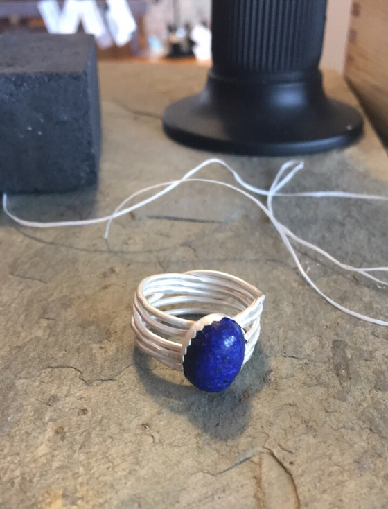 Starting to set this stone!   Yesterday this ring was just wire and some bits of sheet silver.  Now 
