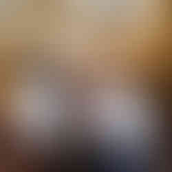 grandmother stands with all her granddaughters and great granddaughters during family photos