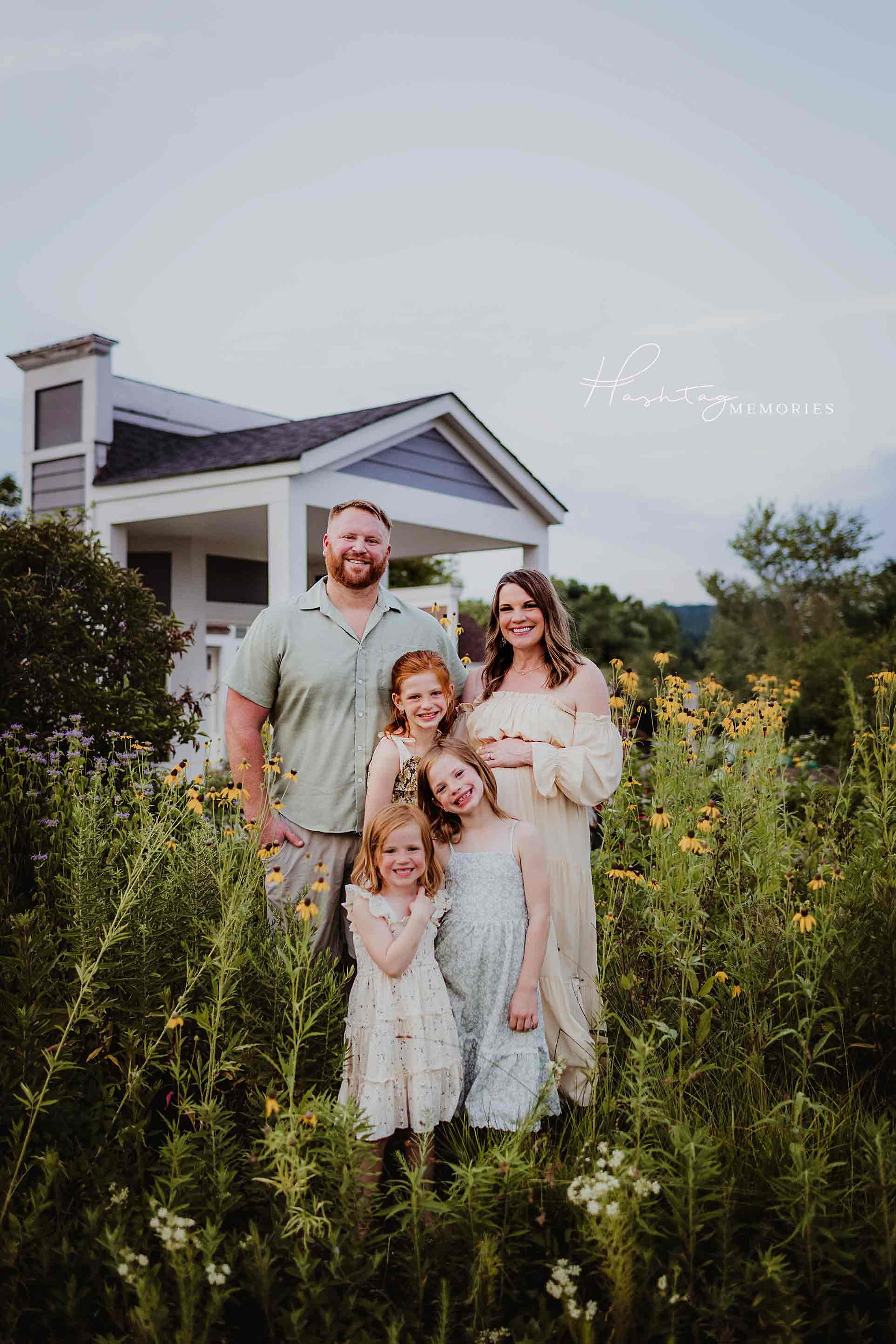 family of five stands in carmel indiana wildflower fields in carmel indiana