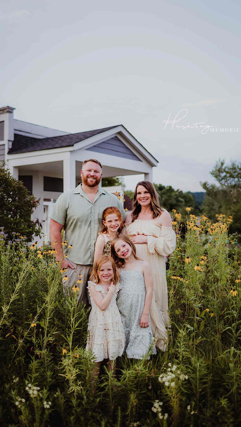 family of five stands in carmel indiana wildflower fields in carmel indiana