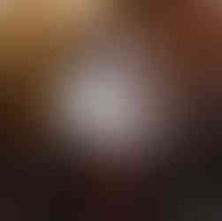 mother holds son during fall family photos