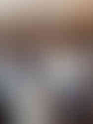 family of four stands in fall field for family photos with dog, field is frosted