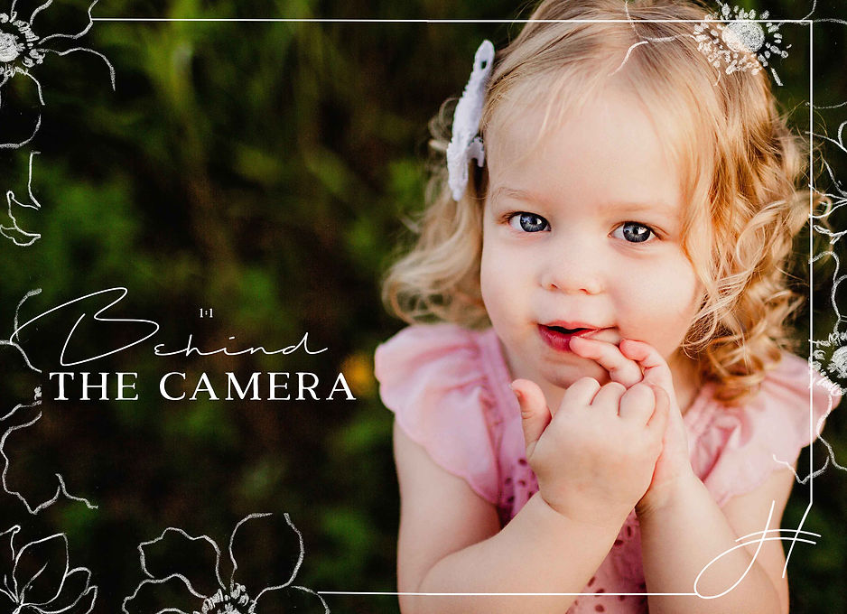 little girl in pink dress and bright blue eyes smiles at camera during indiana family photo shoot with hashtag memories photography