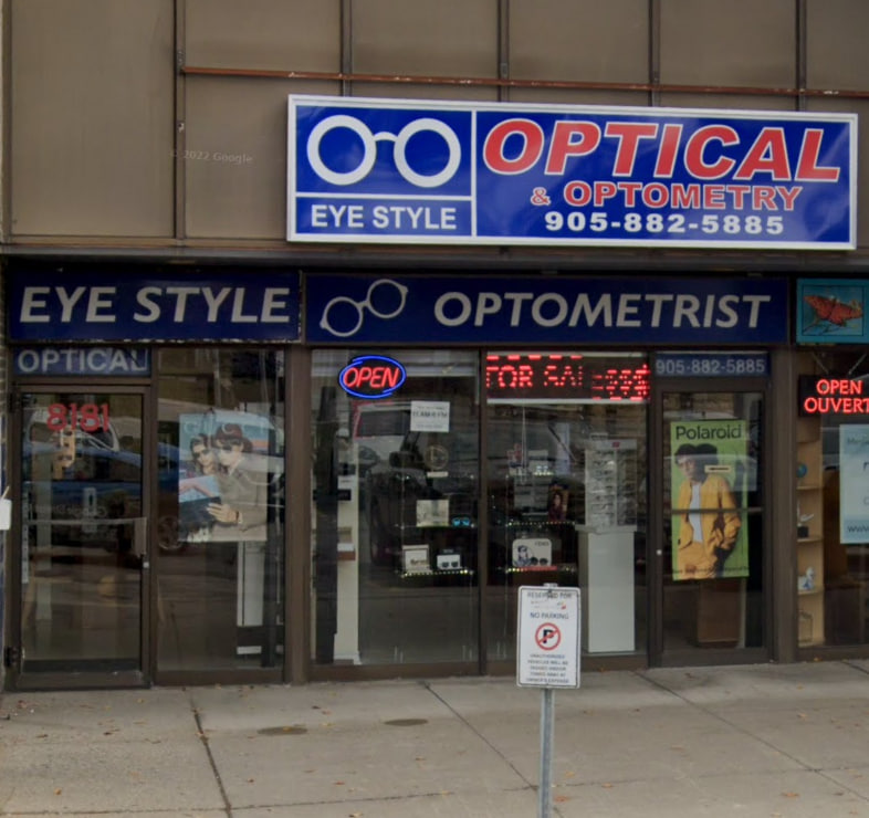 Optometrist examining patient