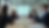 Eye-level view of a modern classroom with students engaged in group discussion
