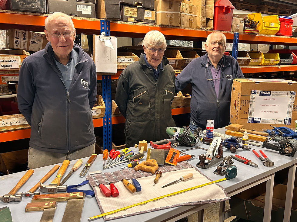 The Rugby carpentry kit packing team. From L-R: Peter (former Uganda country coordinator), Malcolm, and Ian (former Manager of TWAM's former Coventry warehouse)